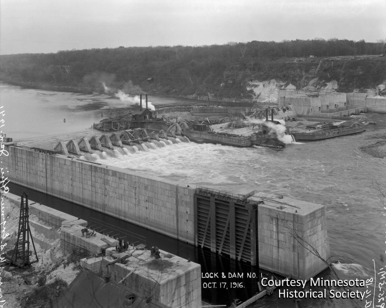 This 1916 photo, taken from the west side of the river, shows Lock & Dam No. 1 under construction. At the upper right are the original foundations built by the Army Corps of Engineers for a future hydroelectric plant. Those foundations would later be demolished to make way for Henry Ford’s larger turbine generators. Courtesy Minnesota Historical Society