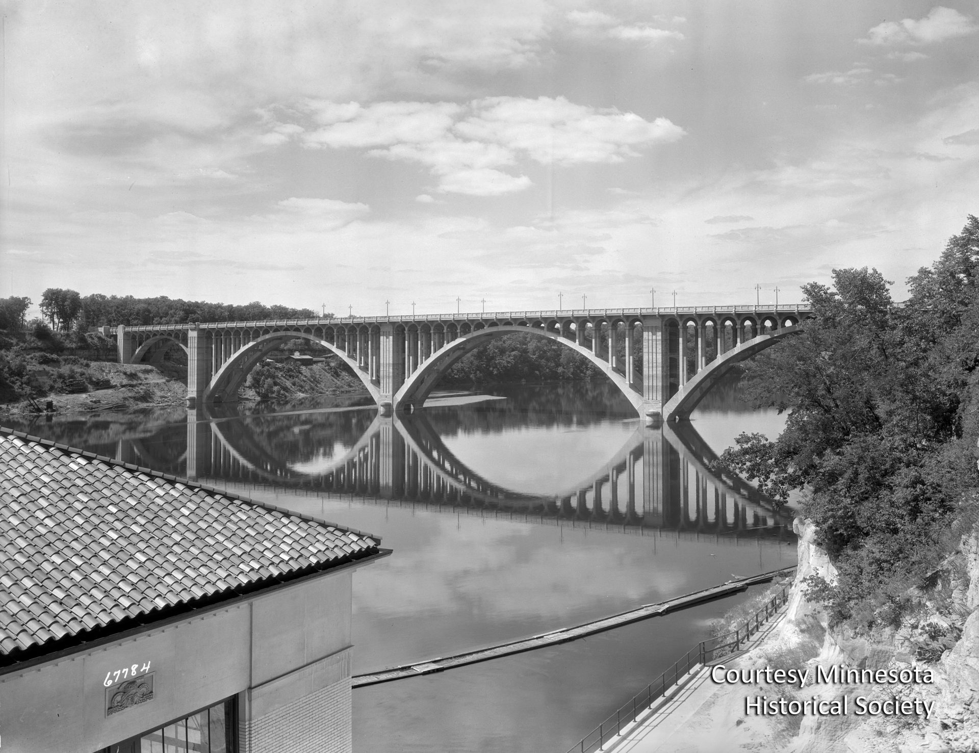 The Intercity Bridge, better known as the Ford Bridge, was completed in 1927, connecting the growing Longfellow neighborhood of Minneapolis to the area around the new Ford plant. Courtesy Minnesota Historical Society